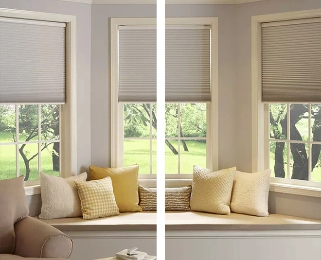 Honeycomb blinds on bay windows with cushioned window seat