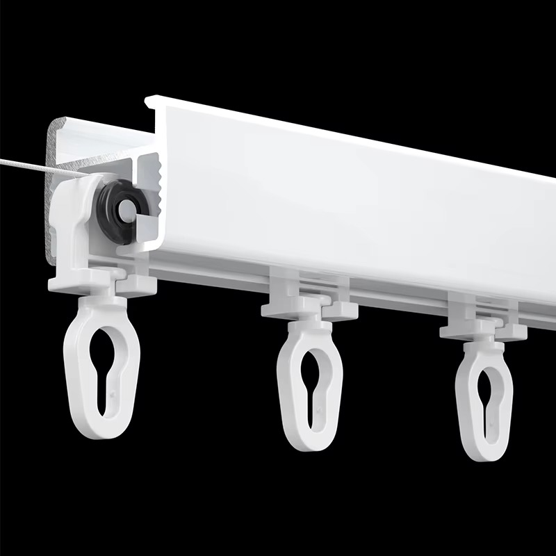 Plastic S-fold curtain track runners installed on aluminum rail with white curtain showing smooth operation