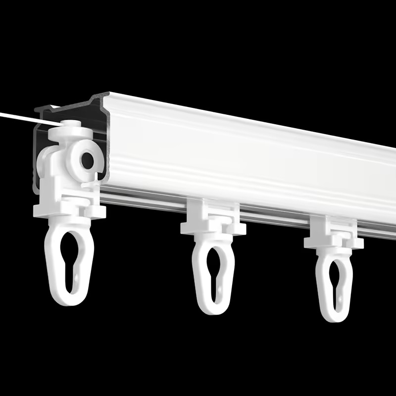 White ripple fold curtain track system showing S-wave gliders attached to rail with visible runners and mounting bracket