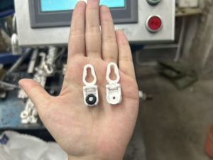 Different curtain runner wheel types and connector variations showing the multiple specifications manufactured - directional wheel on left, multi-directional connector on right