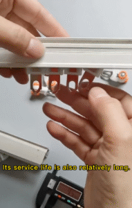 Heavy duty curtain runners showing long service life with orange and white wheels on aluminum track