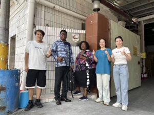 R&C factory team posing with Rebecca and David after successful business visit