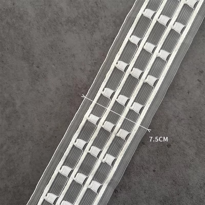 Multiple strips of 7.5cm transparent wave curtain heading tape in gray and white arranged diagonally